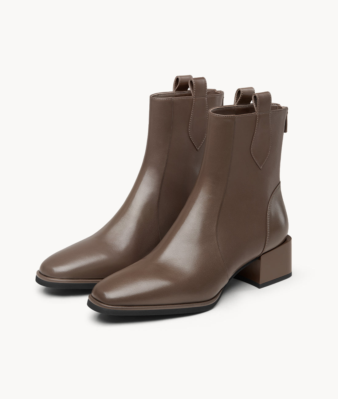 Front view of stylish brown ankle boots in soft lambskin