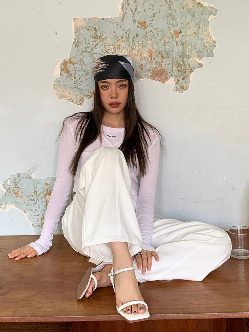 Lounging in my sandals, all in white and feeling comfortably stylish. View the Product