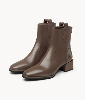 Front view of stylish brown ankle boots in soft lambskin