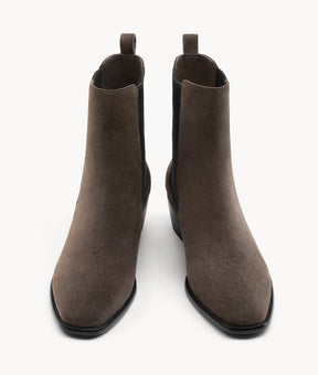Front view of women's brown suede Chelsea boots, highlighting the elegant almond toe