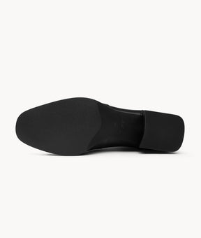 Bottom view of black lambskin ankle boots with a lightweight sole