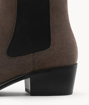A detailed look at the sturdy block heel on these suede Chelsea boots, built for style and all-day comfort