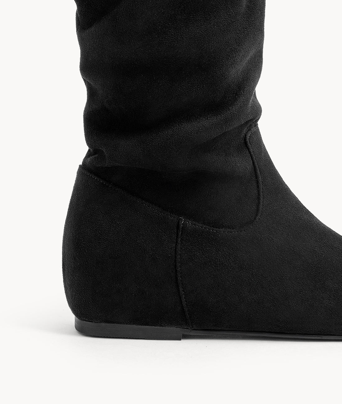 Side profile detail of the boot heel, featuring a concealed 2-inch height boost