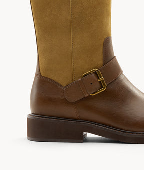 Detail shot showing the contrasting leather panels and expert stitching on brown retro-style cowboy boots