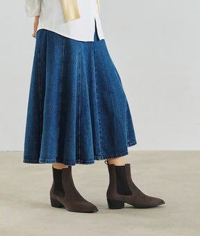 See how these suede Chelsea boots elevate your look, featuring a sleek almond toe and sturdy block heel for versatile style