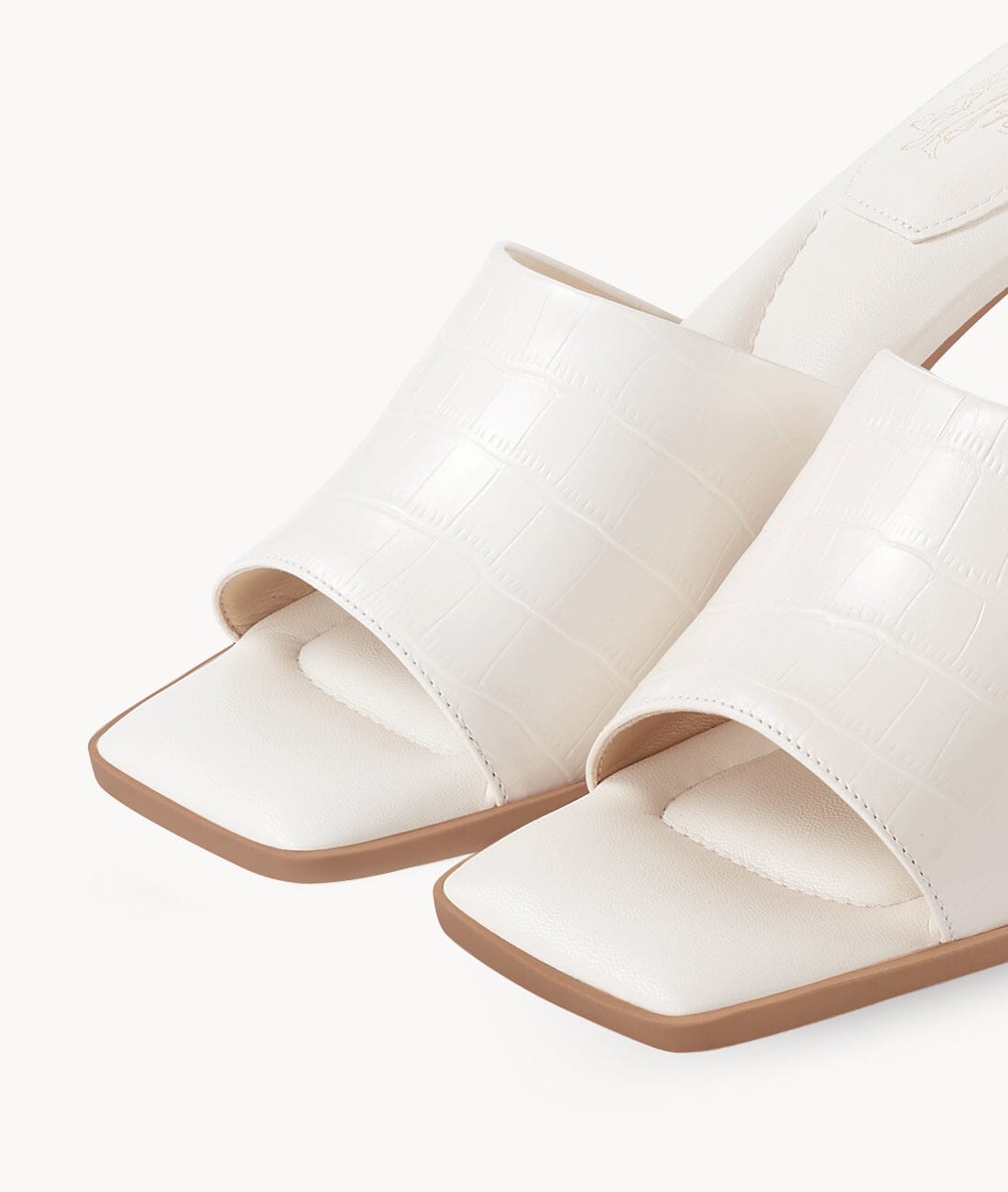 White slide sandals with heels